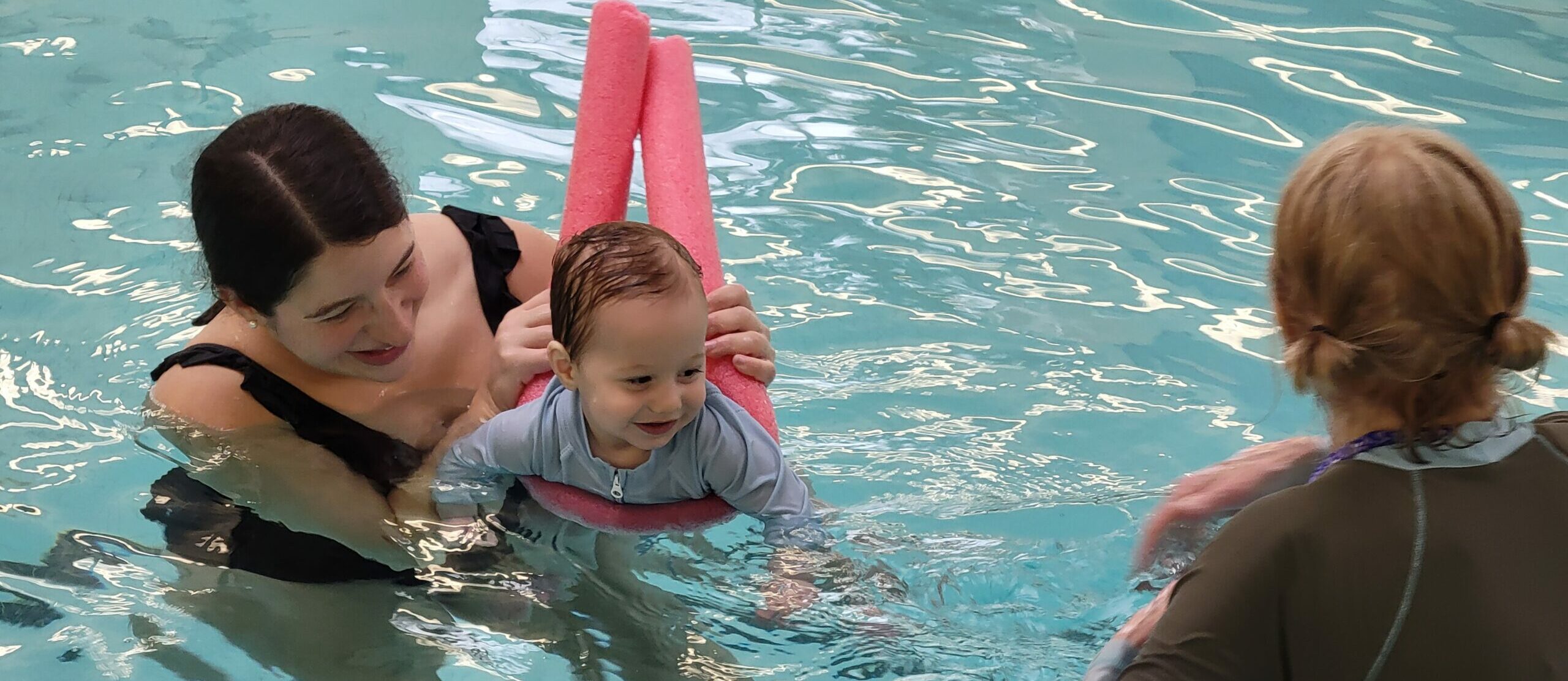 Mom, baby and instructor in the Pool